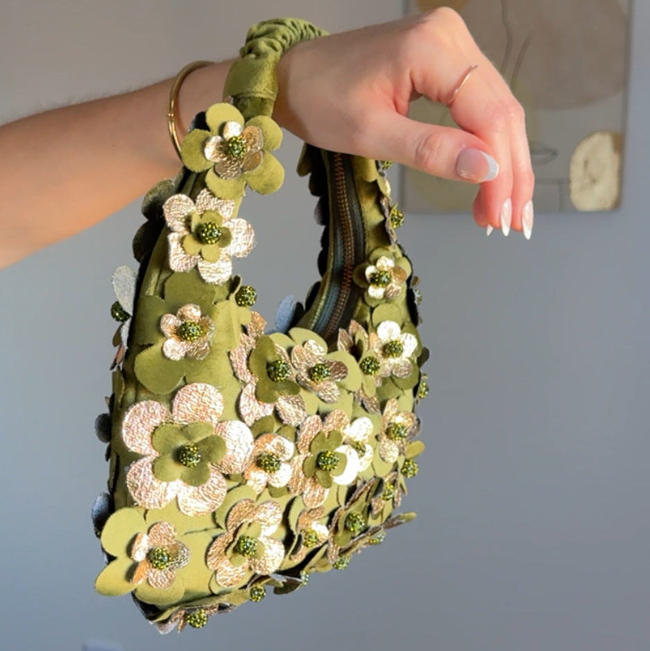 Green 3d flowers mini shoulder purse help by a hand