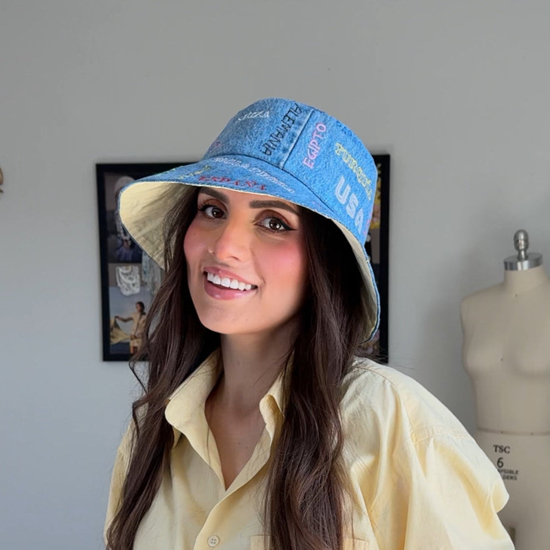 luluisa pattern wearing an upcycled denim embroidered worldcup bucket hat