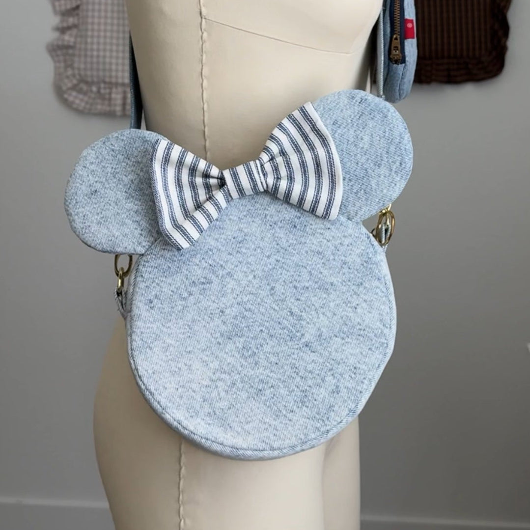 Light blue circular bag with a striped bow , disney crossbody bag