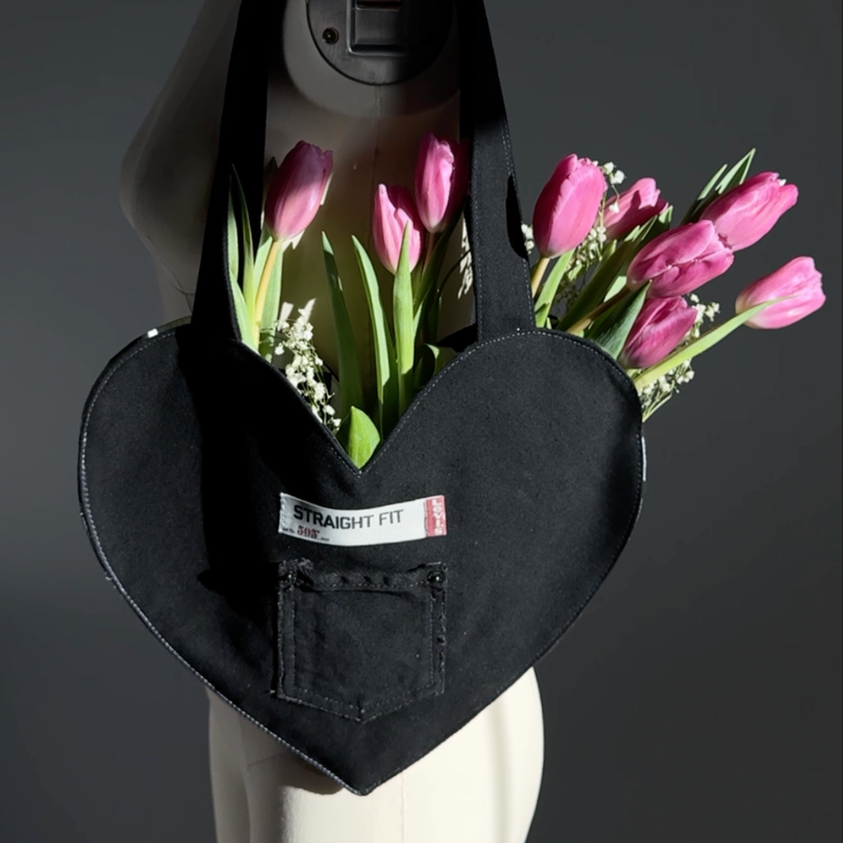 black jeans heart tote bag with tulips